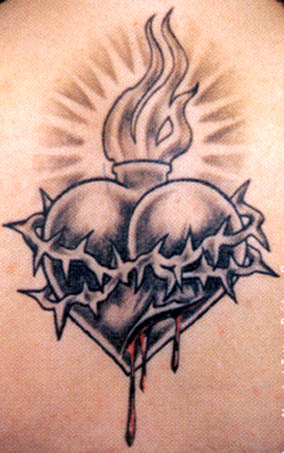 flaming heart tattoos. The sacred heart tattoo